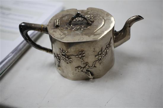 A late 19th/early 20th century Chinese export silver three piece tea set by Hung Chong & Co, Shanghai, gross 65 oz.